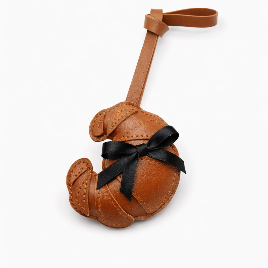 Croissant handtas bedel - zwarte strik